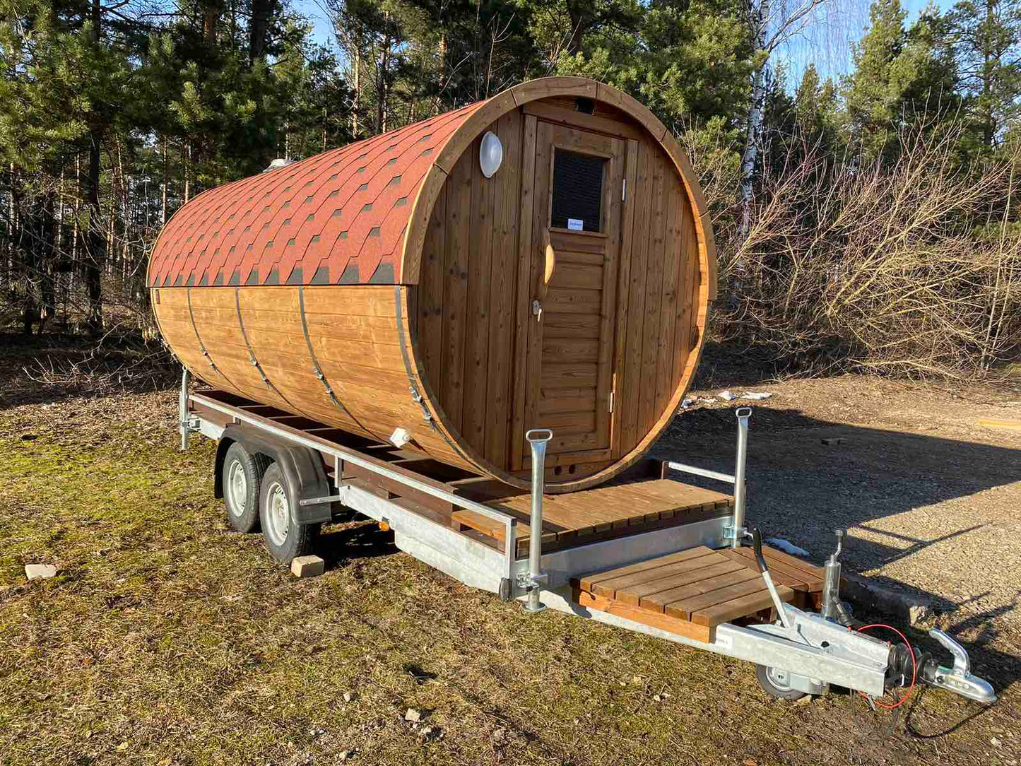Mobile barrel sauna on trailer